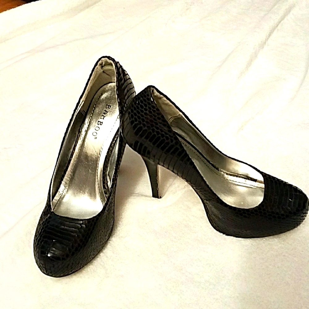 Snake platform heels.